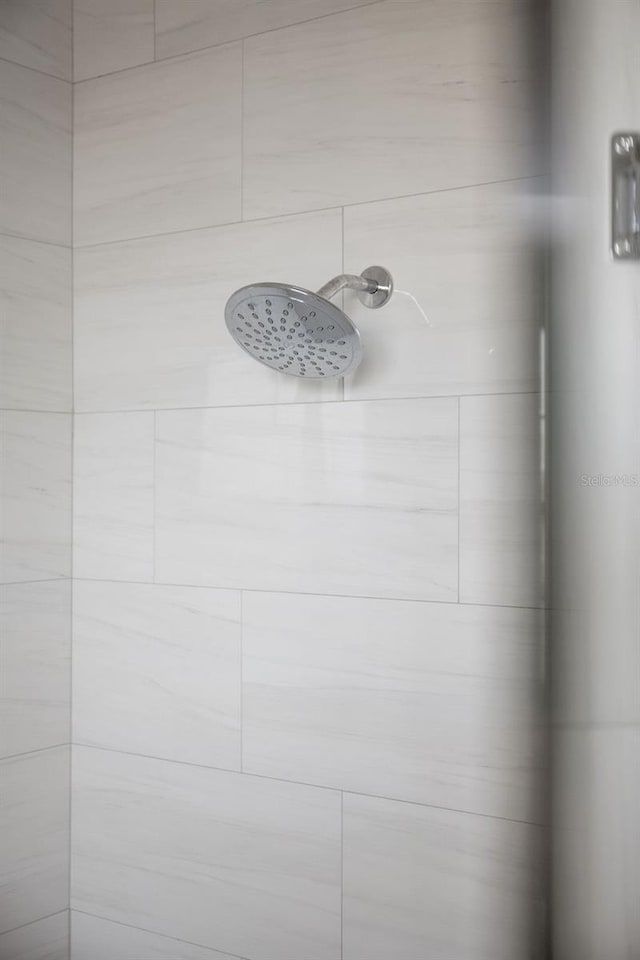 details with a tile shower