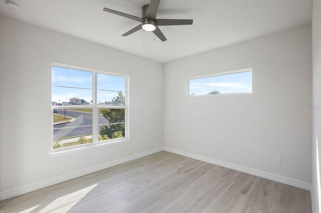 unfurnished room featuring light hardwood / wood-style floors and ceiling fan