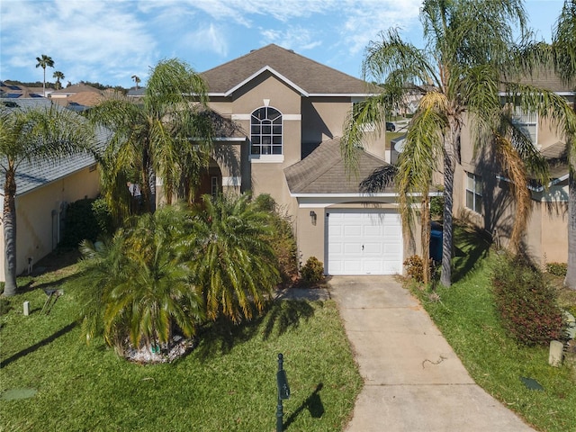 2881 Kokomo Loop, Haines City, FL 33844 - view of front of home with a front yard and a garage