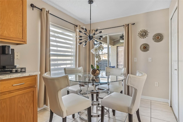 2881 Kokomo Loop, Haines City, FL 33844 - dining room featuring ceiling fan with notable chandelier and light tile floors
