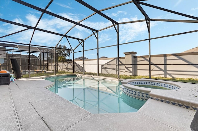 2881 Kokomo Loop, Haines City, FL 33844 - view of swimming pool with a patio area, an in ground hot tub, and glass enclosure