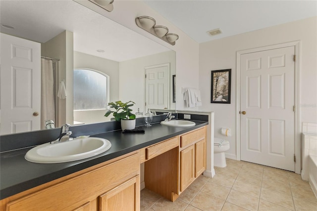 2881 Kokomo Loop, Haines City, FL 33844 - full bathroom with double sink vanity, tile floors, shower / tub combo with curtain, and toilet