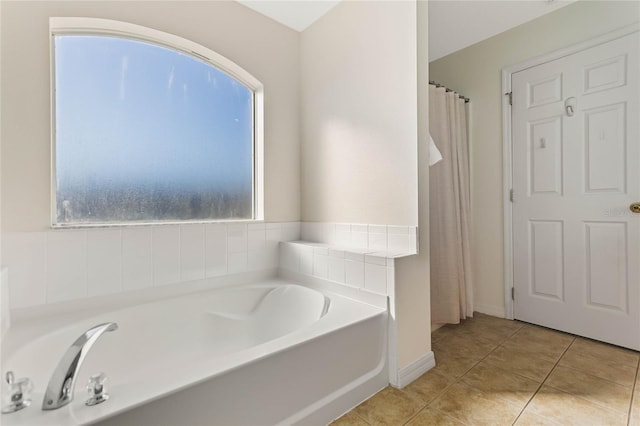 2881 Kokomo Loop, Haines City, FL 33844 - bathroom featuring tile floors and a bath
