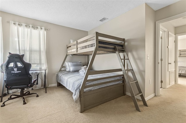 2881 Kokomo Loop, Haines City, FL 33844 - bedroom featuring light carpet and a textured ceiling