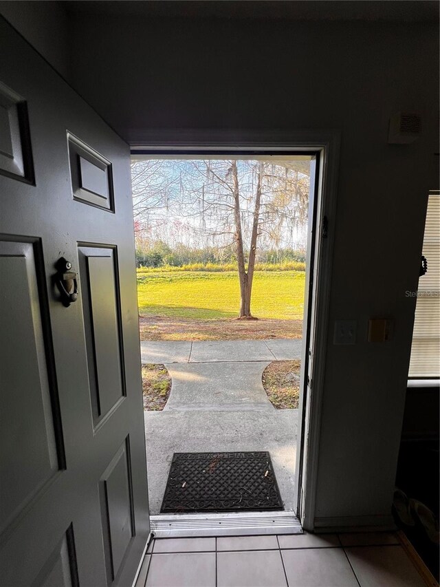 entryway featuring light tile floors