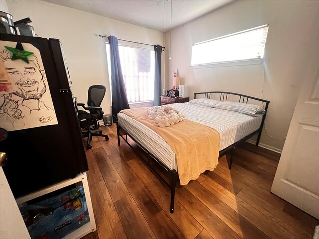 bedroom featuring dark wood-type flooring