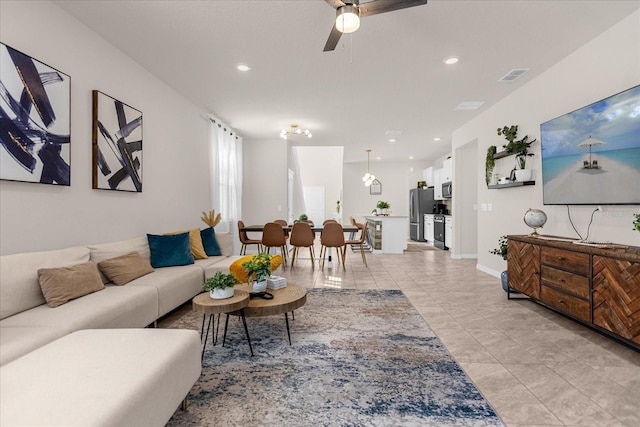 tiled living room featuring ceiling fan