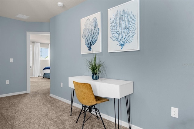 office area featuring light colored carpet