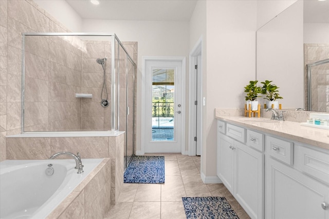 bathroom featuring separate shower and tub, tile floors, and vanity