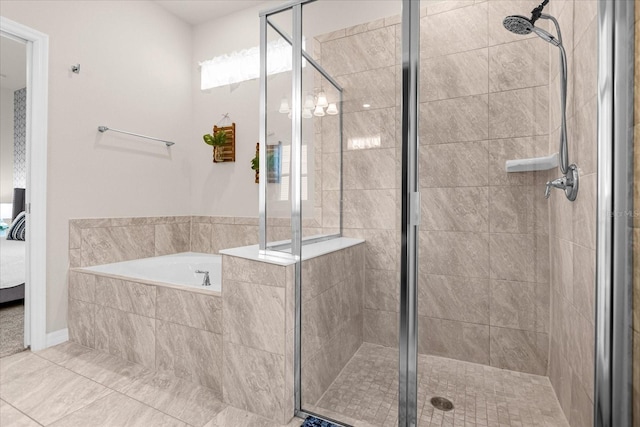 bathroom with an inviting chandelier, plus walk in shower, and tile flooring