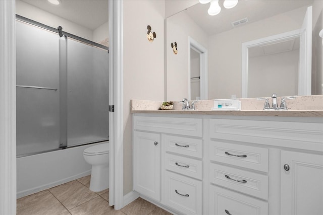 full bathroom featuring enclosed tub / shower combo, toilet, double vanity, and tile floors