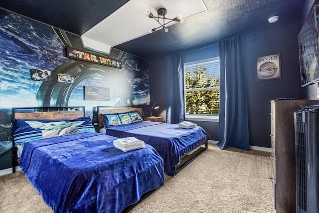 bedroom with light colored carpet and a textured ceiling