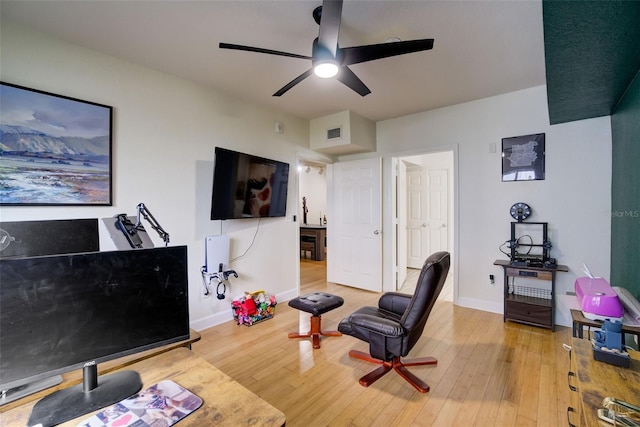 interior space with ceiling fan and hardwood / wood-style floors