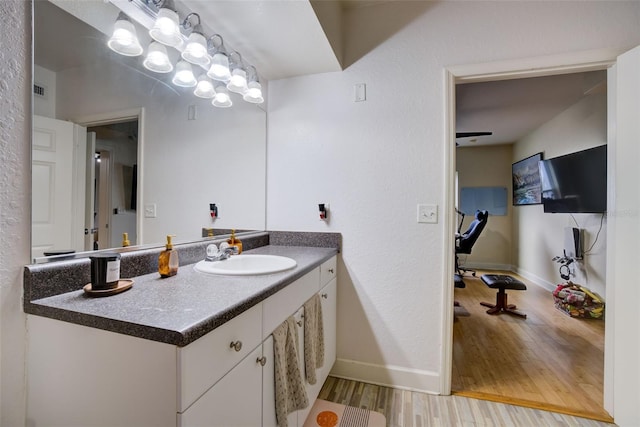 bathroom with vanity and hardwood / wood-style floors