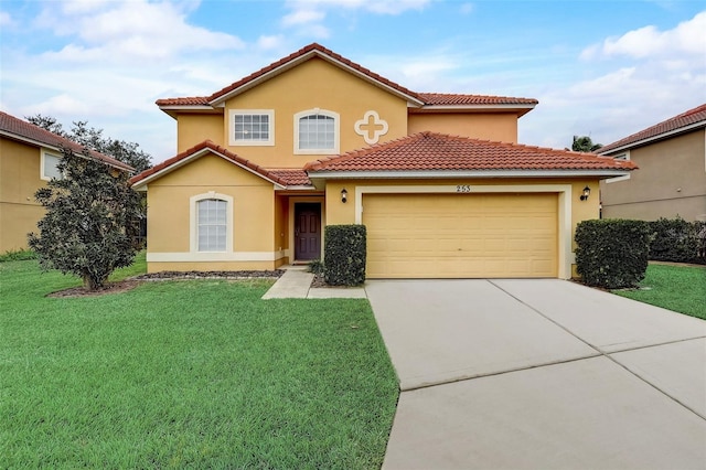 mediterranean / spanish-style home with a front yard and a garage