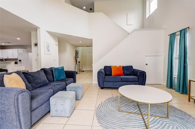 tiled living room with a high ceiling