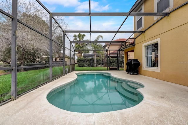 view of pool featuring a grill, a lanai, a yard, and a patio area