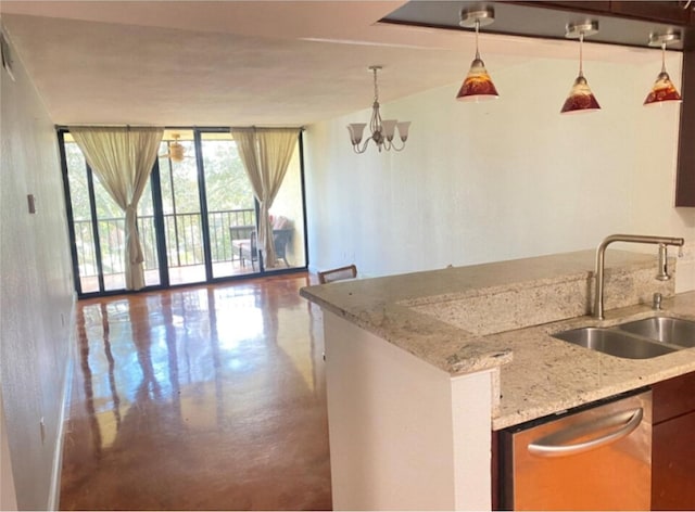 kitchen with sink, hanging light fixtures, stainless steel dishwasher, light stone countertops, and an inviting chandelier