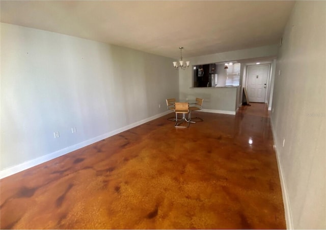 empty room featuring a chandelier