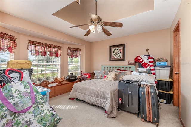 bedroom with light carpet and ceiling fan