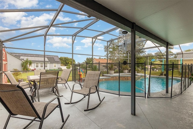 view of swimming pool with a patio and a lanai