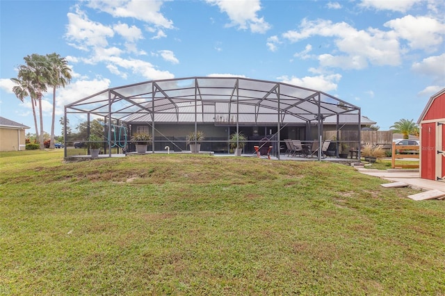 exterior space with glass enclosure, a storage shed, and a yard