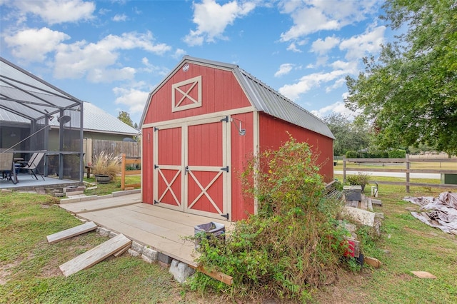 view of shed / structure with a lawn