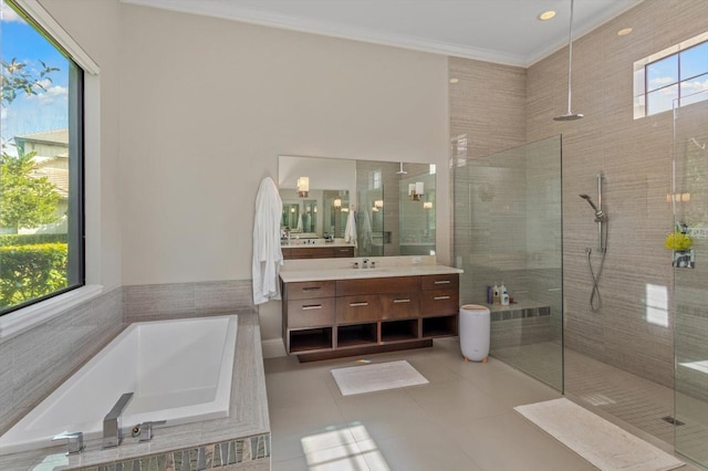 bathroom with separate shower and tub, tile floors, a healthy amount of sunlight, and vanity