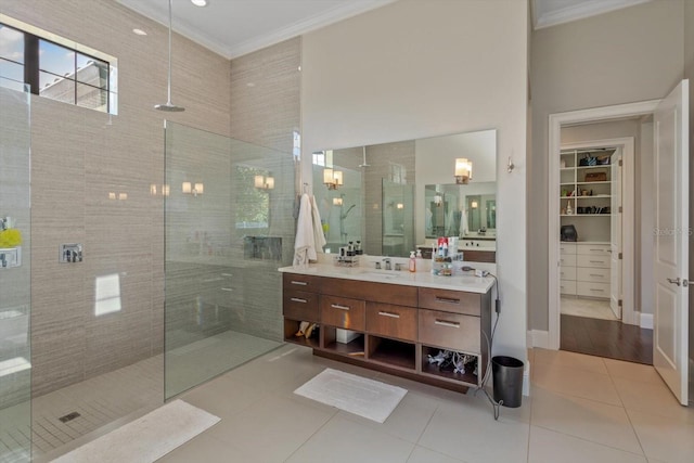 bathroom with tile floors, oversized vanity, and crown molding