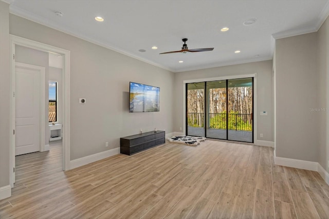 empty room with crown molding, ceiling fan, and light wood-type flooring