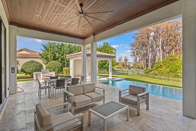 view of patio featuring an outdoor living space, area for grilling, ceiling fan, and a fenced in pool