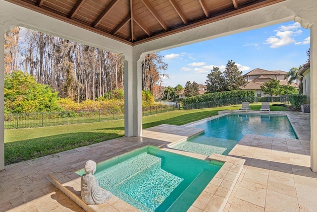 view of swimming pool featuring a yard and a patio