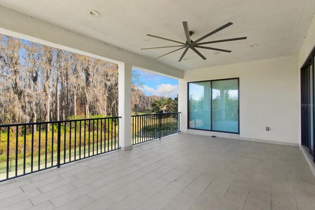 view of patio featuring a balcony