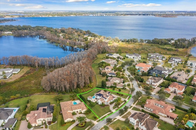 birds eye view of property with a water view