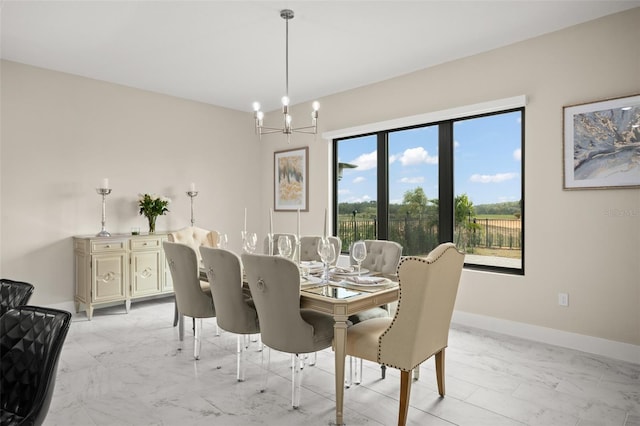 dining room featuring a chandelier, light tile floors, and a wealth of natural light