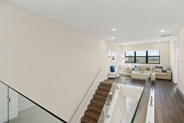 staircase with dark hardwood / wood-style flooring