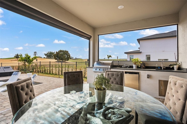 view of patio / terrace featuring grilling area and exterior kitchen