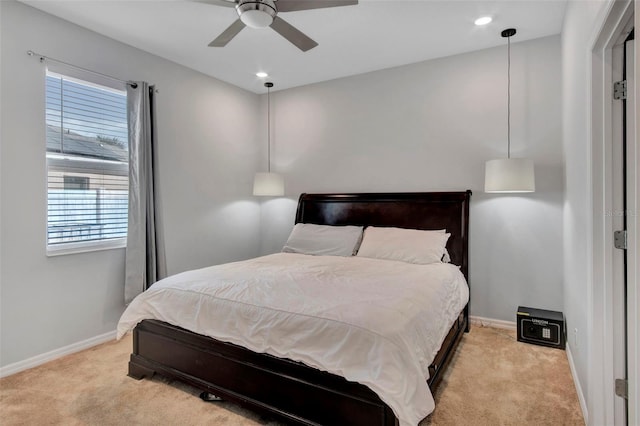 bedroom featuring ceiling fan and light colored carpet