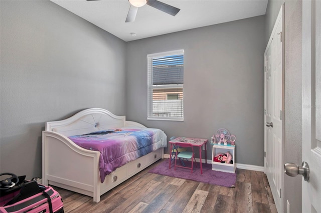 bedroom with wood-type flooring and ceiling fan