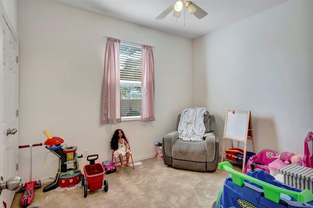 playroom featuring carpet and ceiling fan