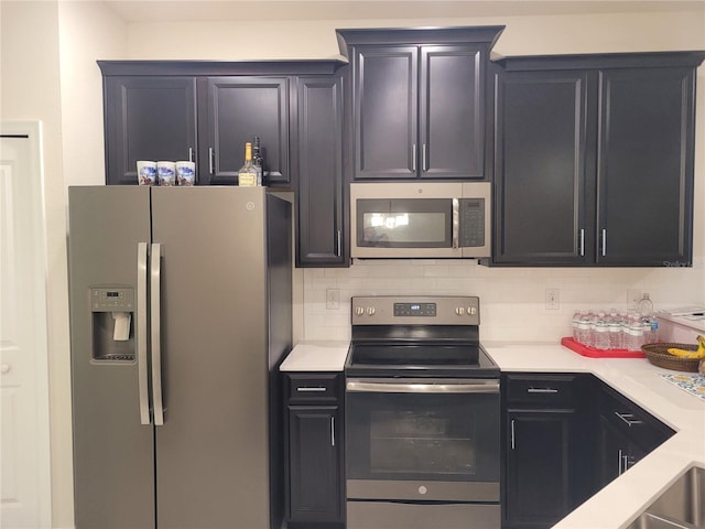 kitchen featuring backsplash and stainless steel appliances