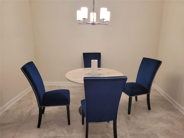 dining area featuring light tile floors and a notable chandelier