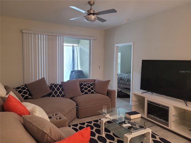 living room with ceiling fan and light tile floors