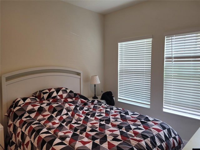 bedroom featuring multiple windows