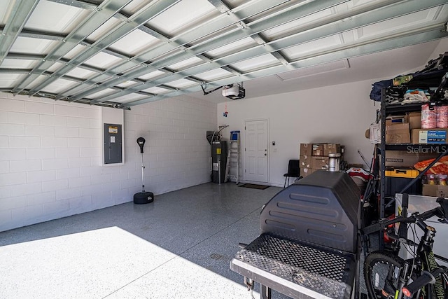 garage featuring electric panel, a garage door opener, and water heater