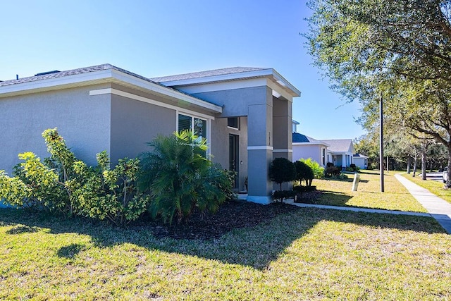 view of property exterior featuring a lawn