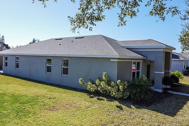 view of side of home featuring a yard