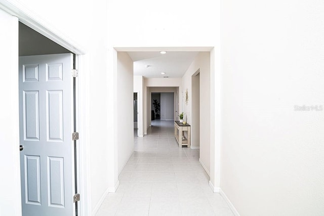 hallway featuring light tile patterned flooring