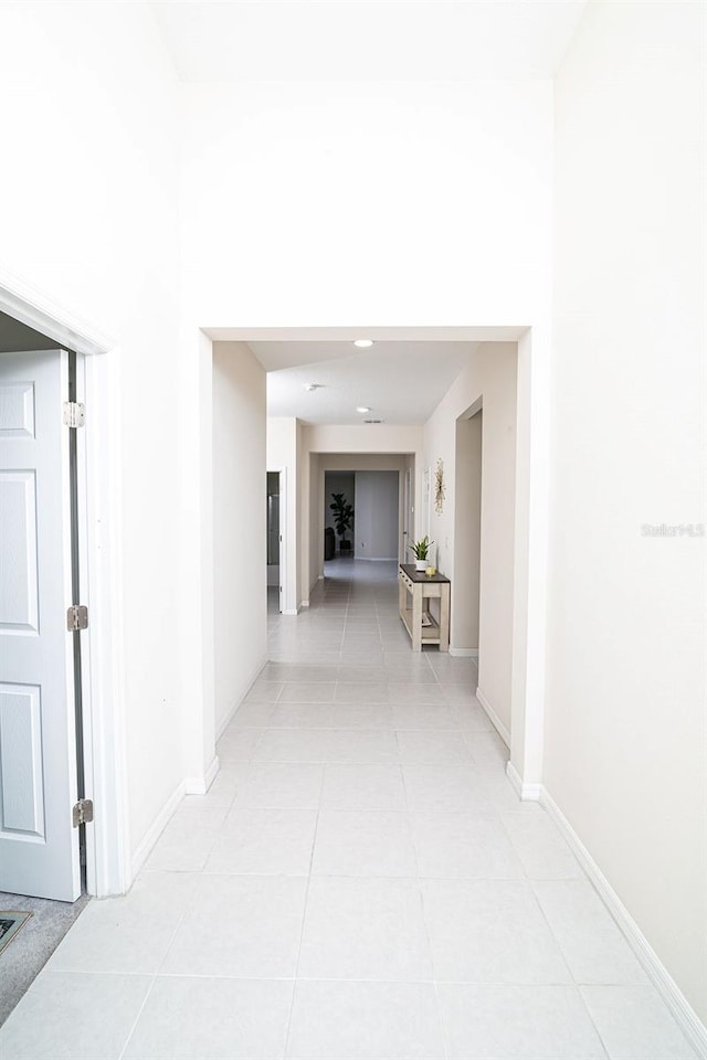 hallway featuring light tile patterned flooring