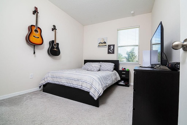 carpeted bedroom with a textured ceiling